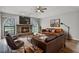 Spacious living room featuring a stone fireplace, wood floors, and lots of natural light at 229 Marcum Trace Dr, Lakeland, FL 33809