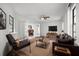 Comfortable living room with wood floors, neutral tones, and access to outdoor spaces at 229 Marcum Trace Dr, Lakeland, FL 33809