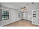 This room features natural light from 3 windows, and updated wood-look floors and a ceiling fan at 229 Marcum Trace Dr, Lakeland, FL 33809