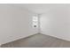 A bedroom with neutral carpet, a single window, and freshly painted, light neutral walls at 2292 Sirena Ln, Mount Dora, FL 32757