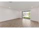 Open living area with tile flooring and sliding doors that provide backyard access at 2292 Sirena Ln, Mount Dora, FL 32757