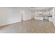Open-concept living area with tiled flooring, seamlessly connecting the kitchen and dining spaces at 2292 Sirena Ln, Mount Dora, FL 32757