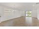 Bright open living space with tile flooring and expansive windows; access to backyard at 2292 Sirena Ln, Mount Dora, FL 32757