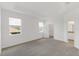 Bright primary bedroom featuring carpeted floors, walk-in closet, and ensuite bathroom at 2292 Sirena Ln, Mount Dora, FL 32757