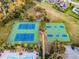 Aerial view of tennis and basketball courts near the pool at 2313 Pesaro Cir, Ocoee, FL 34761
