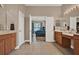 Bathroom view into main bedroom with tile flooring, double vanity, and ample counter space at 2313 Pesaro Cir, Ocoee, FL 34761