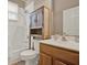 Bathroom with wood cabinets, combination tub and shower, and a bright airy feel at 2313 Pesaro Cir, Ocoee, FL 34761