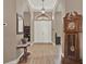 Elegant foyer with hardwood floors, high ceilings, and decorative accents at 2313 Pesaro Cir, Ocoee, FL 34761
