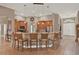 Stylish kitchen featuring wood cabinets, barstool seating, and a modern design at 2313 Pesaro Cir, Ocoee, FL 34761