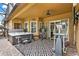 A covered patio area offers a hot tub and exercise equipment for fitness and relaxation at 2313 Pesaro Cir, Ocoee, FL 34761