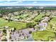 An aerial shot captures the community golf course, and tennis courts, nestled within a residential area at 2520 Nw 53Rd Avenue Rd, Ocala, FL 34482