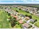 Panoramic aerial view of a residential area with golf course and tree lined streets at 2520 Nw 53Rd Avenue Rd, Ocala, FL 34482