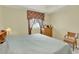 Calm bedroom featuring neutral walls, and wood furniture with plush bedding at 2520 Nw 53Rd Avenue Rd, Ocala, FL 34482