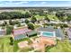 Aerial view of community amenities, including a pool, tennis courts, and clubhouse at 2520 Nw 53Rd Avenue Rd, Ocala, FL 34482
