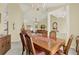 Formal dining area with chandelier and furniture seamlessly connects to the adjacent living spaces at 2520 Nw 53Rd Avenue Rd, Ocala, FL 34482