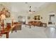 Cozy living room with comfortable seating, natural light, and a seamless connection to the outdoor patio at 2520 Nw 53Rd Avenue Rd, Ocala, FL 34482