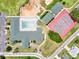 Aerial view of the community tennis courts for fun and exercise, next to the swimming pool at 2520 Nw 53Rd Avenue Rd, Ocala, FL 34482