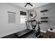 Home exercise room featuring modern exercise equipment, mirrors and mounted yoga mats at 2757 Redblush Ter, St Cloud, FL 34772
