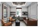 Stylish living room with a coffered ceiling, modern lighting, and comfortable leather seating at 2757 Redblush Ter, St Cloud, FL 34772