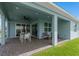 Covered outdoor patio with dining set and ample space for relaxation, seamlessly connected to the home's interior at 2757 Redblush Ter, St Cloud, FL 34772