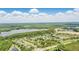 Breathtaking aerial view of a lakeside neighborhood featuring lush greenery and beautiful waterfront properties at 2908 Lee Shore Loop, Orlando, FL 32820