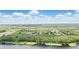 Gorgeous aerial view of a lakeside community, showcasing the tranquil lake and lush surrounding landscape, with property pin at 2908 Lee Shore Loop, Orlando, FL 32820