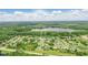 Enchanting aerial perspective of a home nestled in a serene neighborhood near a tranquil lake; outlined property at 2908 Lee Shore Loop, Orlando, FL 32820