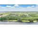 Breathtaking aerial view of a beautiful lake community surrounded by lush green trees, a perfect setting at 2908 Lee Shore Loop, Orlando, FL 32820