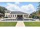 A backyard featuring a sparkling pool with water feature, an outdoor dining area, and manicured lawn space at 2908 Lee Shore Loop, Orlando, FL 32820