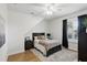Bedroom with wood floors, a ceiling fan, dark furniture and a window with shutters at 2908 Lee Shore Loop, Orlando, FL 32820