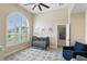 Bedroom featuring a window with shutters, ceiling fan and neutral walls at 2908 Lee Shore Loop, Orlando, FL 32820