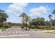 Gated entrance to Country Lakes Estates with beautiful landscaping, ensuring privacy and security at 2908 Lee Shore Loop, Orlando, FL 32820