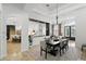Dining room offering an open view of the kitchen and front entry at 2908 Lee Shore Loop, Orlando, FL 32820