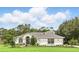 Stunning home exterior featuring a well-manicured lawn and a charming architectural design at 2908 Lee Shore Loop, Orlando, FL 32820