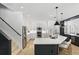 Bright kitchen featuring white cabinets, stainless steel appliances, an island and easy access to the stairs at 2908 Lee Shore Loop, Orlando, FL 32820