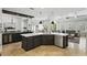 Open-concept kitchen with dark cabinets, an island with a white countertop, and stainless steel appliances at 2908 Lee Shore Loop, Orlando, FL 32820
