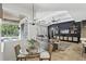 Open-concept living room and kitchen area with access to outdoor pool and large windows for natural light at 2908 Lee Shore Loop, Orlando, FL 32820