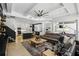 Open living space featuring a comfortable sofa, access to a modern kitchen, and large windows for natural light at 2908 Lee Shore Loop, Orlando, FL 32820
