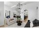 Bright living space with stylish furniture, an open layout, and views into the dining room at 2908 Lee Shore Loop, Orlando, FL 32820