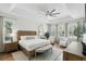 Bright and spacious main bedroom with a tray ceiling, neutral decor, and multiple windows for ample light at 2908 Lee Shore Loop, Orlando, FL 32820