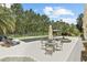 Inviting pool and spa area with mature palm trees, manicured landscaping, gazebo and lounge chairs at 2908 Lee Shore Loop, Orlando, FL 32820