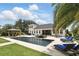 A stunning outdoor pool with a gazebo, lounge chairs, and lush tropical landscaping create a relaxing retreat at 2908 Lee Shore Loop, Orlando, FL 32820