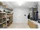 Organized storage room featuring shelves, a door, and space for luggage and other items at 2908 Lee Shore Loop, Orlando, FL 32820