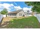 Expansive backyard enclosed by a white fence, offering privacy and ample space at 2913 Wilshire Rd, Clermont, FL 34714