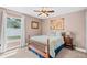 Cozy bedroom features a comfortable bed, natural light from the window, and a classic map at 2913 Wilshire Rd, Clermont, FL 34714