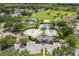 Expansive aerial showcasing community amenities: pools, playground, sports courts, and green space, offering a rich lifestyle at 2913 Wilshire Rd, Clermont, FL 34714