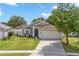 Charming single-Gathering home featuring a well-manicured lawn and a two-car garage at 2913 Wilshire Rd, Clermont, FL 34714