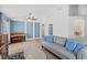 Inviting living room with a gray sofa, accent pillows, and wood-look flooring at 2913 Wilshire Rd, Clermont, FL 34714