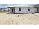 New construction with expansive backyard featuring white siding, perfect for customization and outdoor activities at 30124 Misty Pines Road, Mount Dora, FL 32757