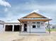 New construction home featuring a modern design with a covered entrance and attached two-car garage at 30124 Misty Pines Road, Mount Dora, FL 32757